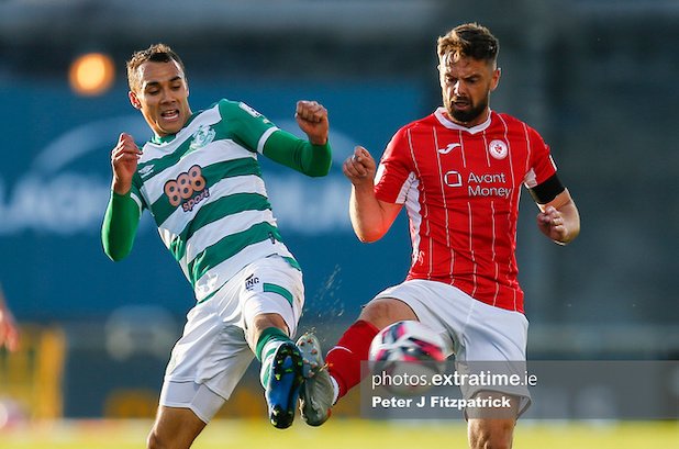 Graham Burke and Greg Bolger challenge for the ball